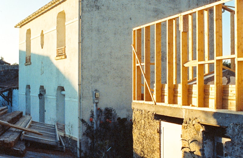 New wood-framed addition being built onto an existing home