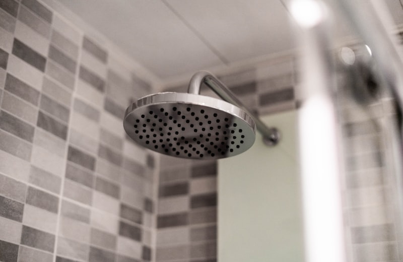 Rain shower head detail in a tiled shower